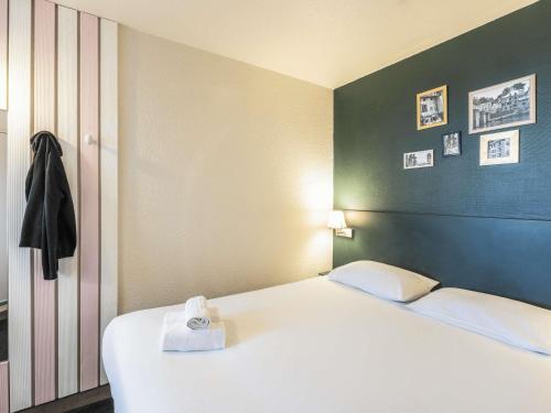 Postel nebo postele na pokoji v ubytování Greet Hotel Limoges Nord