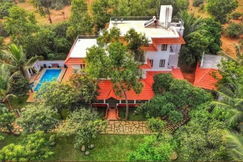 an aerial view of a house with an orange roof at Sun Farm Retreat in Auroville
