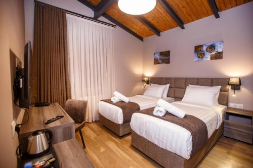 Voodi või voodid majutusasutuse Hotel Tsiga toas