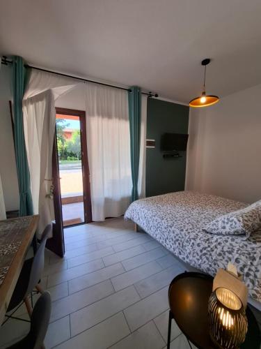 a bedroom with a bed and a table and chairs at TartaRigo b&b in Bologna