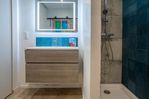 a bathroom with a sink and a mirror at Maison de charme à Lorgues in Lorgues