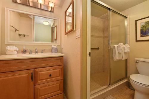 a bathroom with a shower and a sink and a toilet at Kihei Akahi C616 · AKH C616 Cozy Condo Near Beach w Ocean View P in Wailea