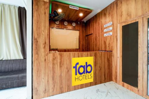 two pictures of a room with a fico hotel sign at FabHotel O PNR Continental in Hyderabad