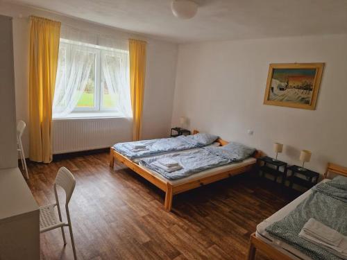 Postel nebo postele na pokoji v ubytování Chalupa Barros