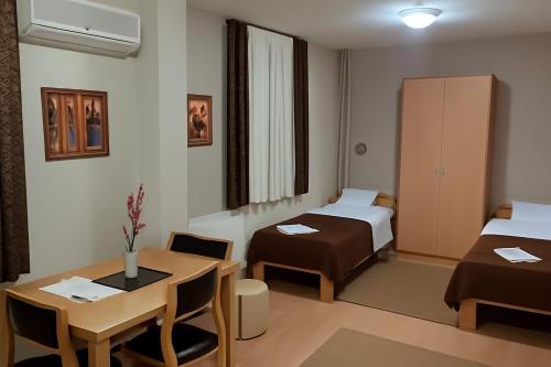 Postel nebo postele na pokoji v ubytování Hotel Topcider