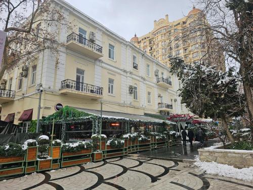 a street with a store in front of a building at Nizami 37 in Baku