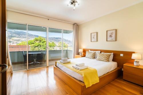 Postel nebo postele na pokoji v ubytování GuestReady - Relaxing escape with pool