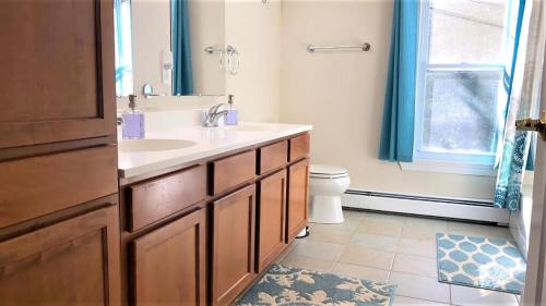a bathroom with a sink and a toilet at Marlin House in Cape May