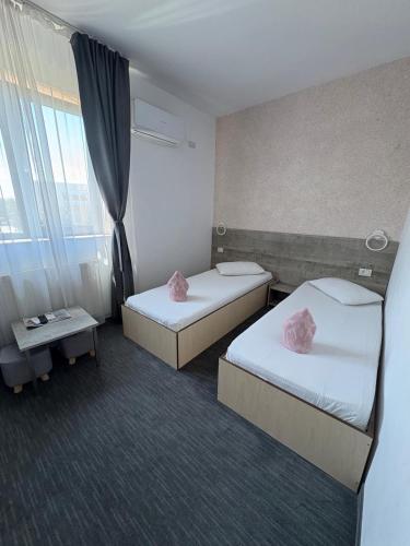 Postel nebo postele na pokoji v ubytování Hotel Minion