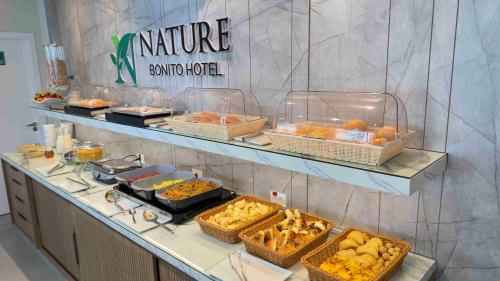 a buffet with many different types of food in baskets at Nature Bonito Hotel in Bonito