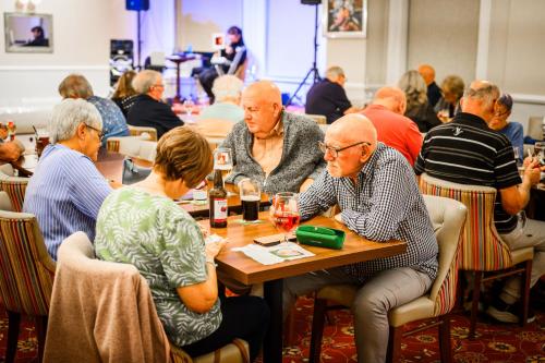 a group of people sitting at a table with wine glasses at The Esplanade Hotel in Scarborough