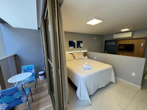 a bedroom with a bed with two teddy bears on it at Beira-mar do Cabo Branco com varanda UN113 in Penha