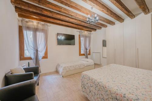 Ένα ή περισσότερα κρεβάτια σε δωμάτιο στο San Marco Suite - 5 min da San Marco