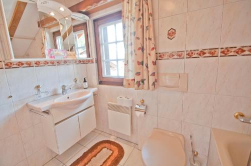 a bathroom with a sink and a toilet at Furggen, Chalet Museum in Grächen