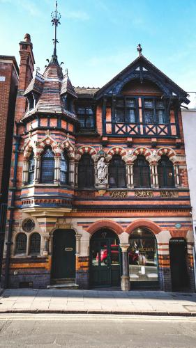 an old building with a cross on top of it at Fothergill House - Entire Luxury Townhouse - City Centre in Nottingham
