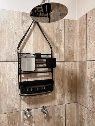 a surfboard hanging on a wall in a bathroom at S Residence in Kimberley