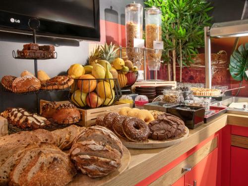 a bakery with many different types of breads and pastries at ibis Cannes Centre in Cannes