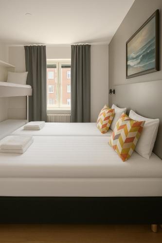 Llit o llits en una habitació de Hotell Drott