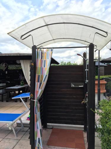 a white umbrella on top of a patio at Villa Margherita in Montaquila