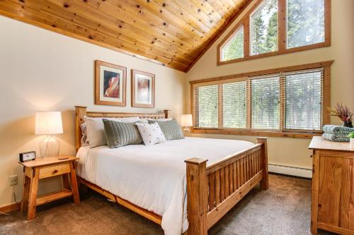 a bedroom with a large bed with a wooden ceiling at Mtn-View Deck Stunning Fraser Home By Ski Shuttle in Maryvale
