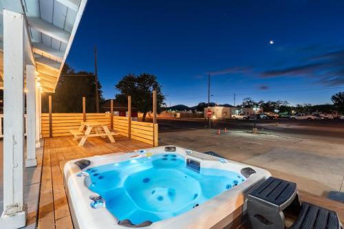 a jacuzzi tub on a patio with a parking lot at The Cowboy Social Unit 5 in Williams