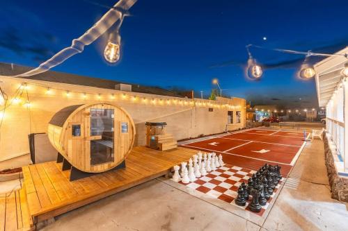a ping pong court with a chess board and lights at The Cowboy Social Unit 5 in Williams