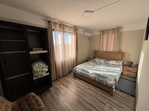a small bedroom with a bed and a dresser at Raj Adventures Hideaway - 7 Cascades in Vacoas