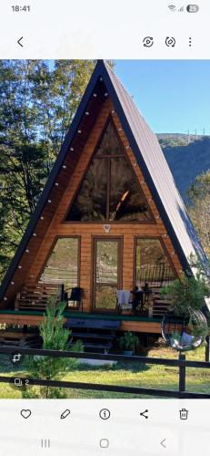 a frame cabin with a large glass window at Martvili canyon cottage Love nest in Martvili