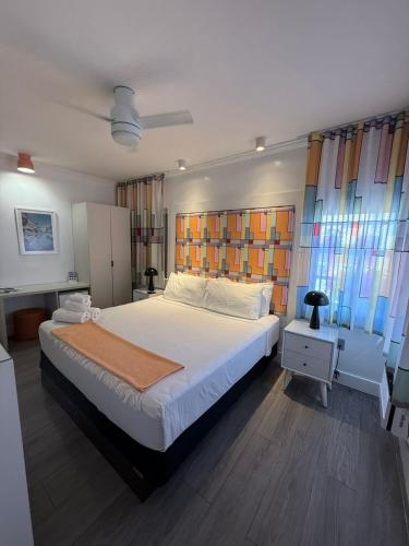 a bedroom with a large bed in a room at The Cove By Renzzi in Miami Beach