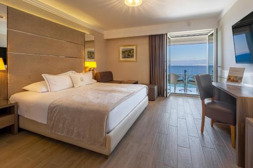 Ένα ή περισσότερα κρεβάτια σε δωμάτιο στο Hotel Vila Rova
