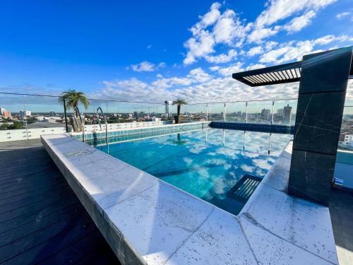 a swimming pool on the roof of a building at Two-bedroom apartment in Santa Cruz de la Sierra