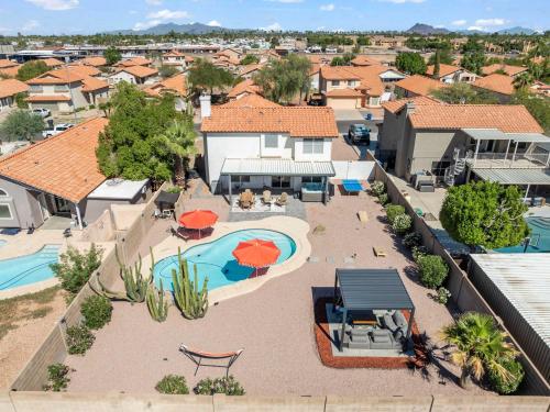 an aerial view of a house with a swimming pool at Heated Pool, Hot Tub, Games & more! in Mesa