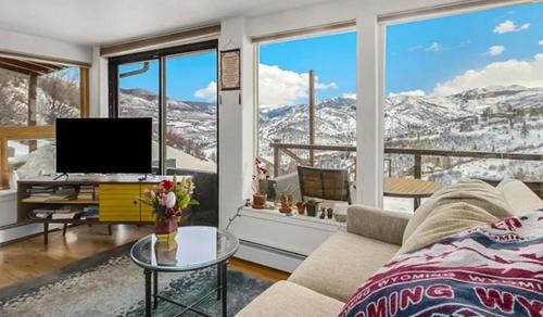 a living room with a view of a mountain at Private Aspen Haven Views in Woody Creek