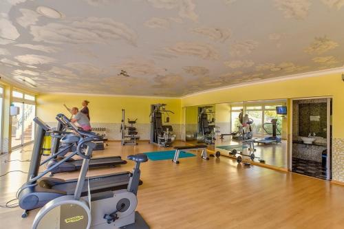 a fitness room with a gym with tread machines at Presa De Moura in Carvoeiro