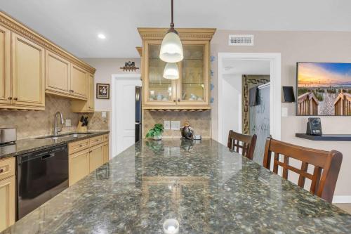a kitchen with a large counter top in a room at Driftwood Days Pet Friendly Beach Home in Myrtle Beach