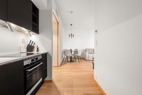 Η κουζίνα ή μικρή κουζίνα στο Moderne 2 - Roms Leilighet i Vannkunsten Syd