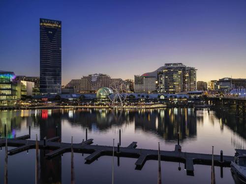 a view of a city with a harbor and buildings at ibis Sydney Darling Harbour in Sydney
