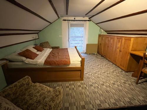 a bedroom with a bed in a room at Studio Apartman Barbara in Josipdol