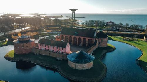 an aerial view of a castle in the water at Sveriges minsta Hotell! Hôtel Gruyère in Landskrona