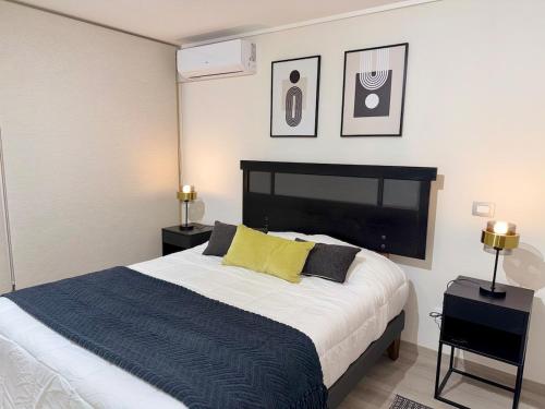 Ένα ή περισσότερα κρεβάτια σε δωμάτιο στο Moderno departamento en Las Condes