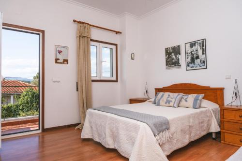 Postel nebo postele na pokoji v ubytování Alojamento Da Cunha