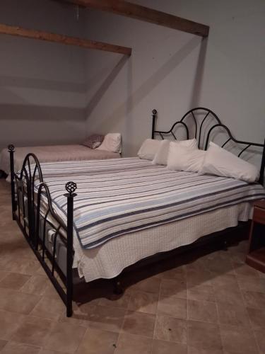 a bedroom with a bed with a black frame at Connect with Nature on Quiet Horse Farm in Troutman