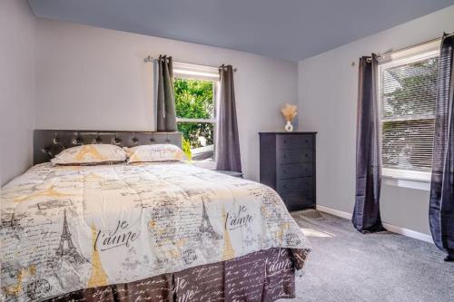 a bedroom with a bed with a comforter at Mineola Bay Lakeview and Access Fully Furnished Monthly and Seasonal Rental in Fox Lake in Fox Lake