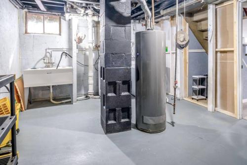 a room with a sink and a water heater at Mineola Bay Lakeview and Access Fully Furnished Monthly and Seasonal Rental in Fox Lake in Fox Lake