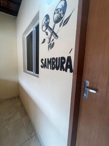 a door with a santa clara sign on it at Pousada Alto do Tambá in São Francisco
