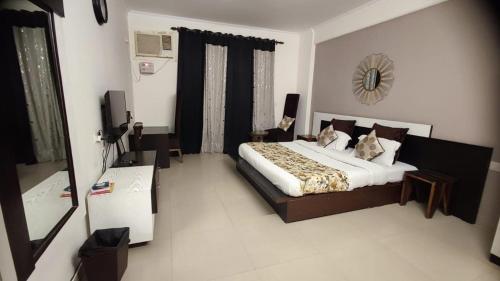 Ένα ή περισσότερα κρεβάτια σε δωμάτιο στο Aloha Ganges Apartments, Rishikesh