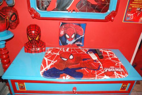 a toy chest with spider man cushions on it at Catania SpidermanHouse I in CTA