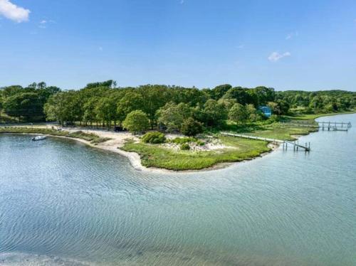 an island in the middle of a body of water at Haven on Glynn by Rove Travel - Coastal Luxury in Shelter Island Heights
