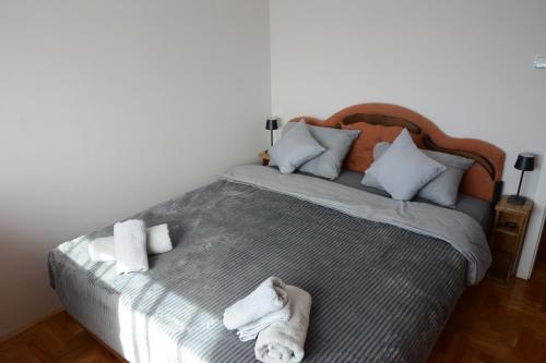 Ένα ή περισσότερα κρεβάτια σε δωμάτιο στο Apartman Bella Vita