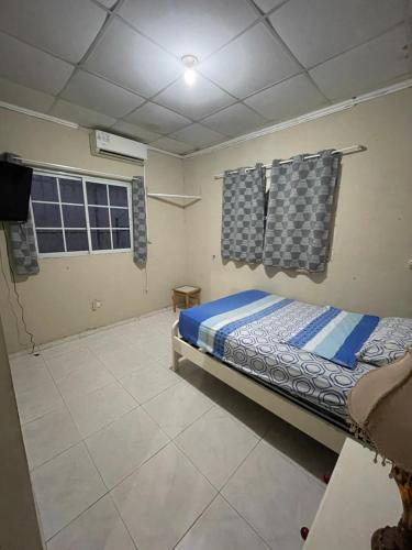 Ένα ή περισσότερα κρεβάτια σε δωμάτιο στο Geos House